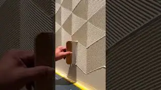 The process of applying art paint for finishing walls in an apartment