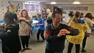 Niall and friends dance the Hokey Cokey at the Shaw centre