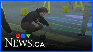 Students and staff repainting Pride crosswalk