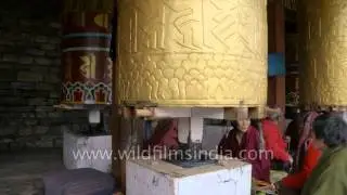 Buddhists turn massive golden prayer wheels in Bhutan