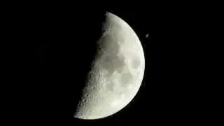 The International Space Station (ISS) crosses (transit) the moon