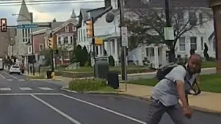 Raw: Man Throws Large Rock at Police Cruiser