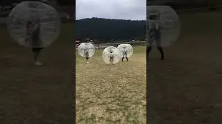 Guy films his friends running into each other with giant inflatable balls!