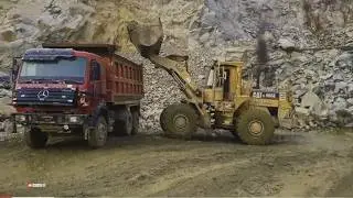 Wheel loader loading heavy rocks into mercedes dump truck | Extreme Quarry Work