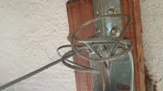 Changing a spring on a tension spring garage door system