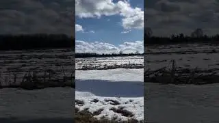 Snow on field with sun 🌞 and clouds ☁️ with blue sky