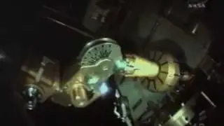 Discovery astronauts begin space walk