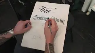 Theosone writing in my notebook at Scriptorium Berlin