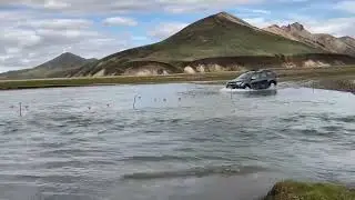 Beautiful Iceland: car crossing river at landmannalaugar / Dacia Duster