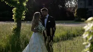 A Summer Wedding party in the courtyard at Hengrave hall in Suffolk