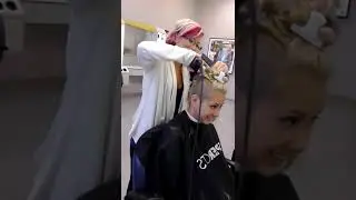 Haircut with a clipper for a blonde woman