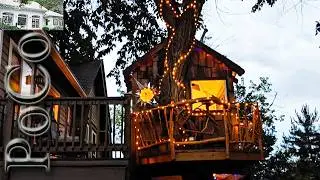 Cozy homemade treehouse with a beautiful multi-wood deck