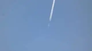A nice cruising Cessna 680 Citation flying overhead with contrails at 40,000 ft
