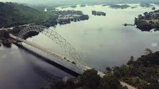 You'll love this.✨🚁A bird&rsquo;s-eye view of Akosombo &mdash; calm by day, magical by night. #flywithgenius
