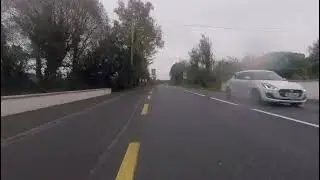 N16 Glenfarne Village - Cyclist on busy road with no cycle or walking path