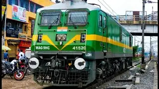 WAG9HC 41520 UNIQUE SILVER/GREEN/YELLOW/GREEN FREIGHT ENGINE RESTS AT YARD