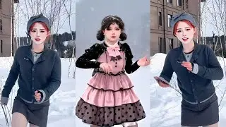 Beautiful girl dancing robot dance in the snow