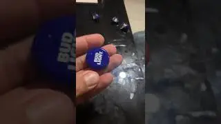 Bending a beer cap backwards with one hand