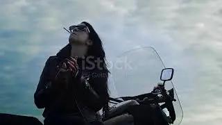 Girl Biker Is Smoking Sitting On Motorcycle
