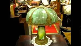 Antique Lamp with slag glass shade and slag glass base.