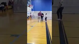 Tater shooting hoops at Special Olympics 