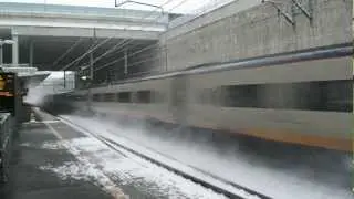 Eurostar Class 373 passing Stratford International with kick back of Snow