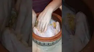 Cooking duck with sauerkraut in a clay pot.