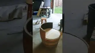 made a swivel chair/desk out a whiskey barrel