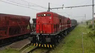 Thunderous, Heavy Rain Freight Crossing Led by Classic GE Power