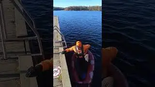 Getting into my Advanced Elements Packlite kayak on lake Flaten