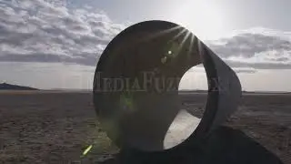 Stock Video - Sun rays shinning over the Lucin Sun Tunnels in Utah
