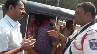 SI Ghouse Khan of Madhapur Traffic PS trying to sensitizing passengers on Piloting with Driver.