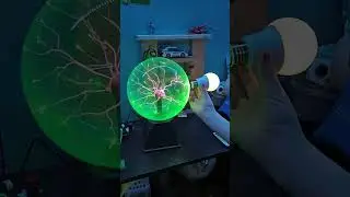 Lighting up a light bulb with a plasma ball