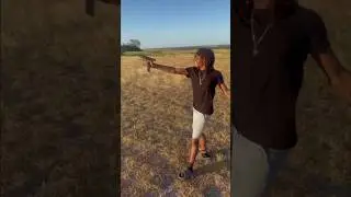 Teaching thug how to shoot gun