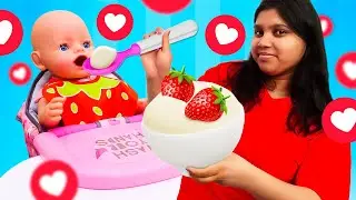 The doll woke up hungry & the nanny pretended to play cooking with toy food for her in the morning.