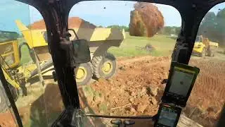 Next Generation Caterpillar Excavator 323 Loading Off Road Trucks