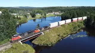 Awesome 4K Aerial View! Short and Fast Stack Train CN 123 Passing Palmers Pond - Dorchester, NB
