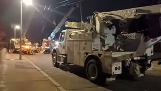 Eversource and Verizon, cleaning up after a Crane knocks down utility pole on Fisher ave