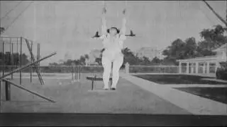 clown and woman on swing perform in vaudeville