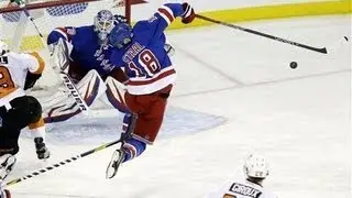 Hockey player Marc Staal gets a slap shot to the face