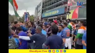 Excited cricket fans celebrate Indian's victory outside Melbourne cricket stadium