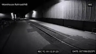 Security Camera Footage of Side of Warehouse at Night