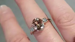 Rose gold oval cut morganite ring with two round diamonds