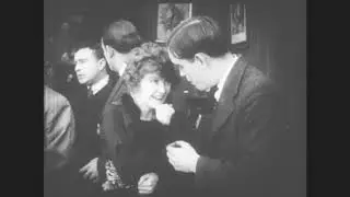 Couple Kisses and Holds Black Cat (Excerpt from Silent Film), 1910s
