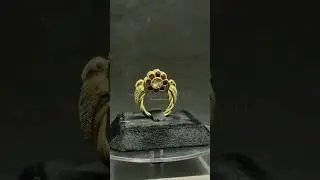Spinning beauty. This antique ring features a mesmerizing rotatable flower, each petal a vibrant gem