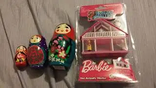 Matroyoshka dolls and worlds smallest Barbie Dream house.