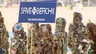'Trash People' statues parade in Barcelona to highlight sea litter