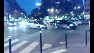 Paris bus turning left from right lane at subway station 