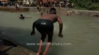 Young boys swim to beat the Delhi heat   Ultra Slow motion HD