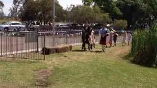 Mitch wearing his possum skin cloak and leading the parade to open the school fair